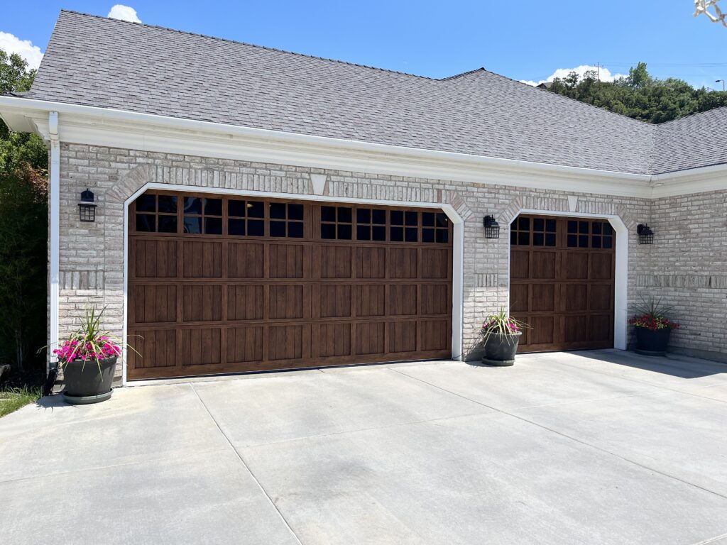 a garage door with a brick roof