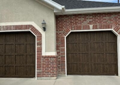wooden garage doors with brick walls
