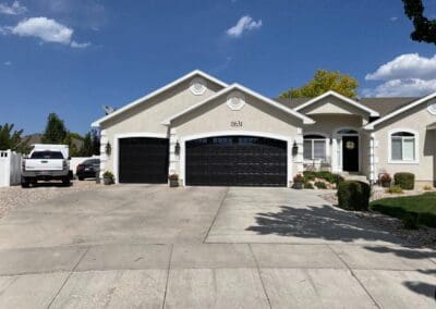 Nice suburban home with new dark garage doors