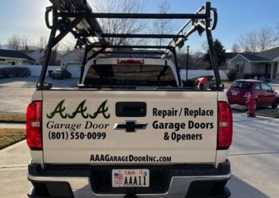 Backside of AAA Garage Door pick up truck
