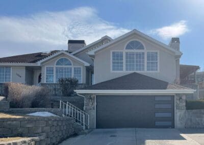 Multi-story home with a nice garage on the bottom. There are stairs leading to the entrance