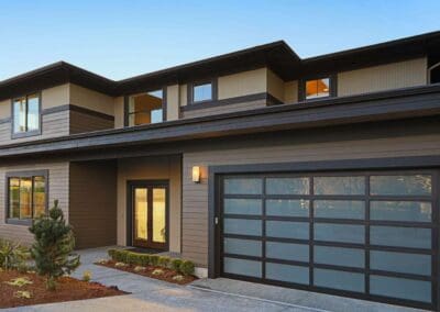 Fancy modern home with glass garage doors