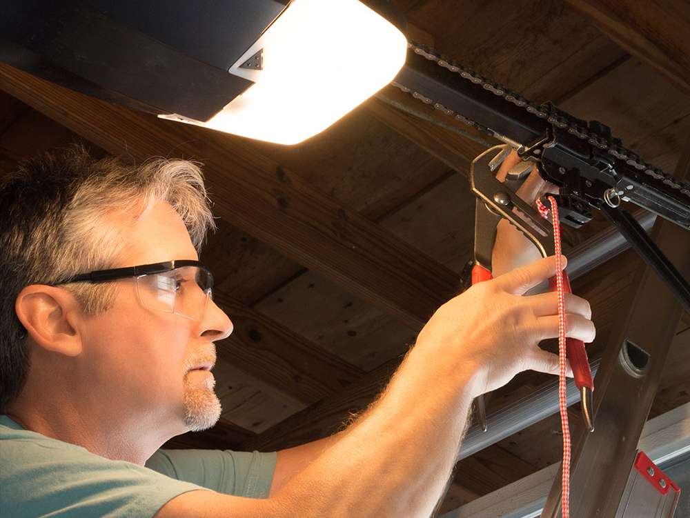 a person working on a light fixture