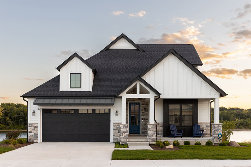 White Home with a classic raised panel garage door-